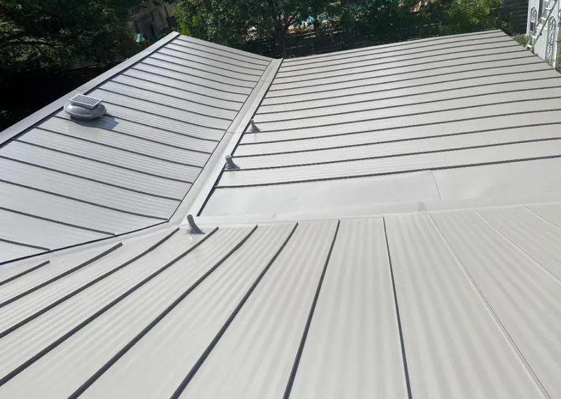 Solar attic fan installed on a metal roof for Roof Ventilation in Bel Air South